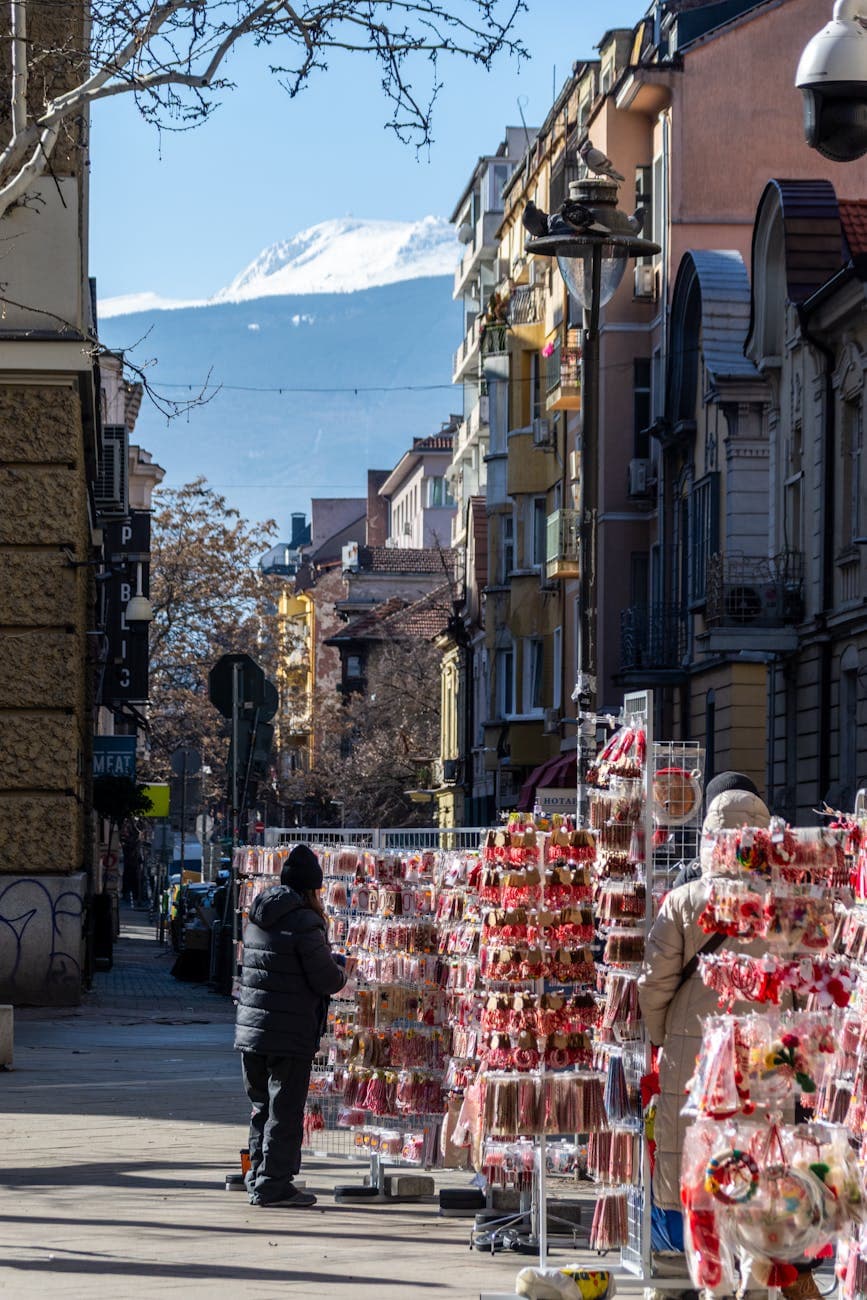 Street market stalls in Sofia with mountain backdrop, showing the Bulgarian retail landscape for tea brand entry