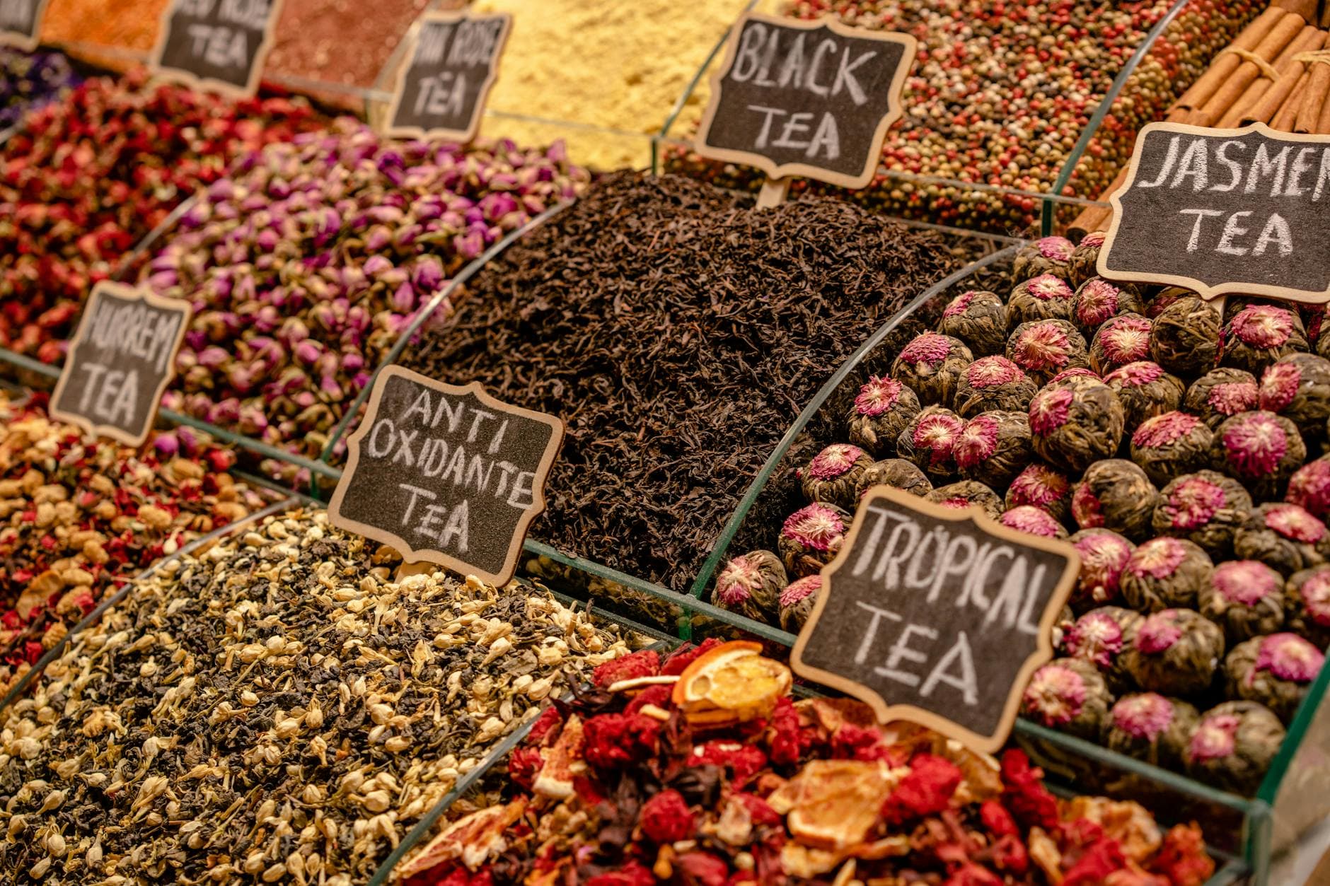 Market display of different herbal tea varieties side by side, showing multi-SKU range