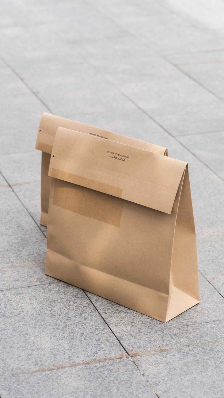 Eco-friendly kraft paper bags outdoors illustrating how paper packaging creates natural eco-positioning for tea brands targeting sustainability-conscious consumers