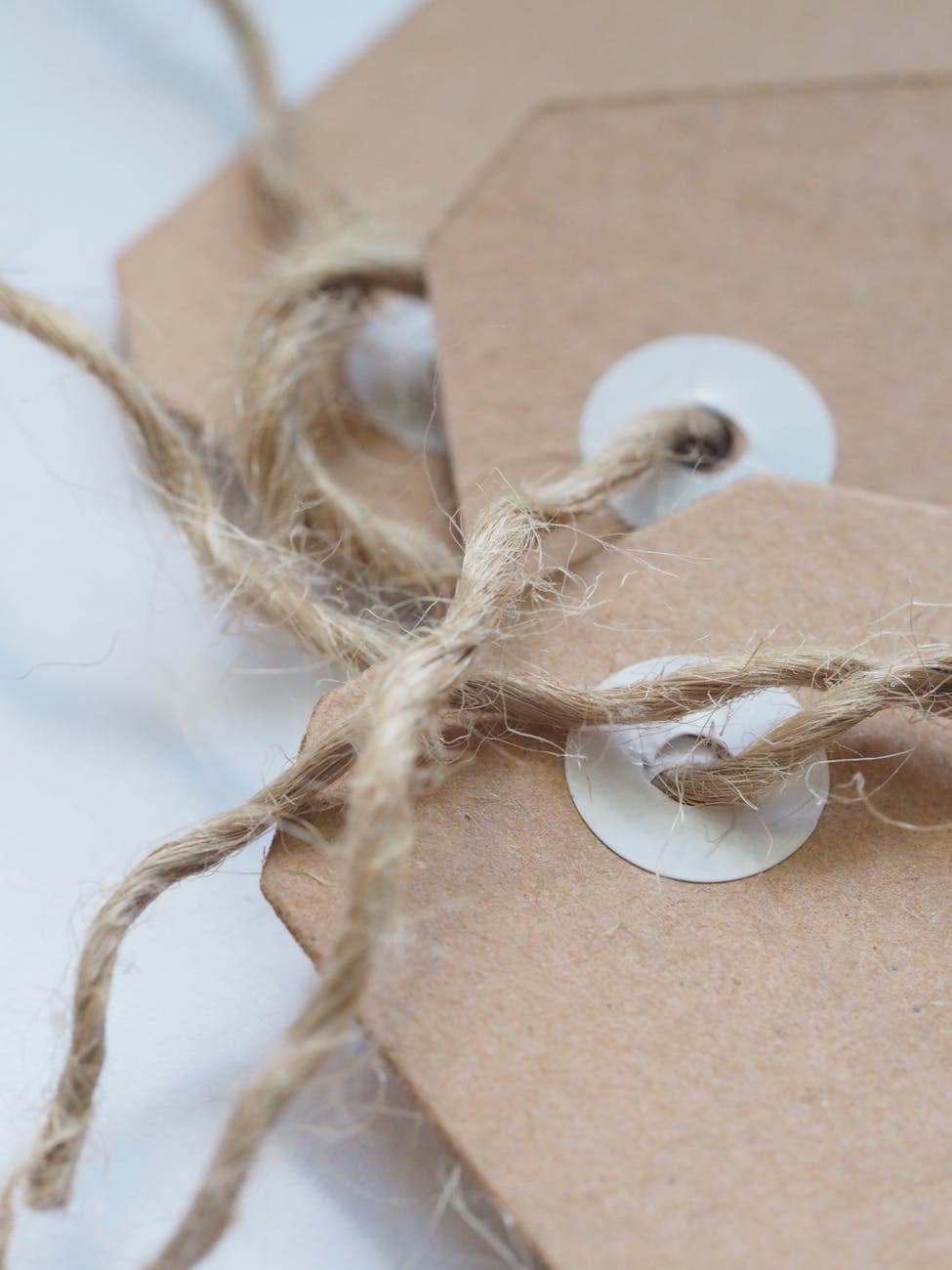 Brown cardboard tags with twine - the texture and construction of a typical hard tag