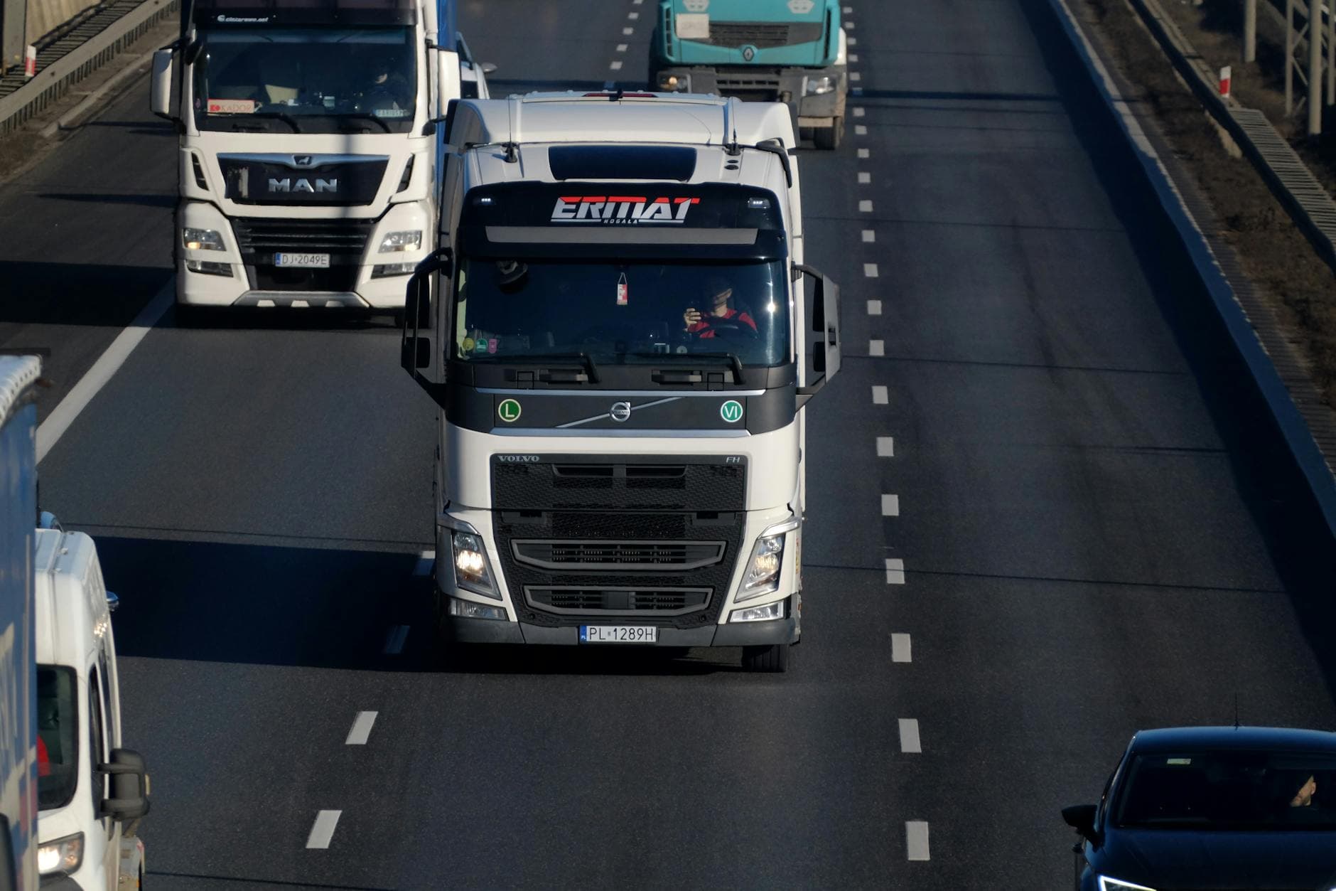 Heavy-duty freight trucks on a European highway, logistics and cargo transport