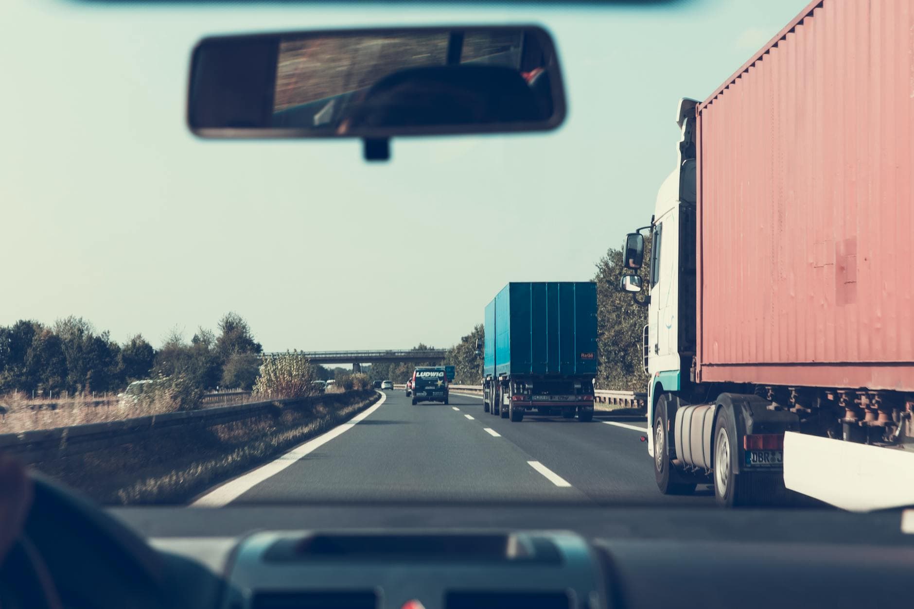 Truck on German highway, view through rearview mirror toward Bamberg, Germany